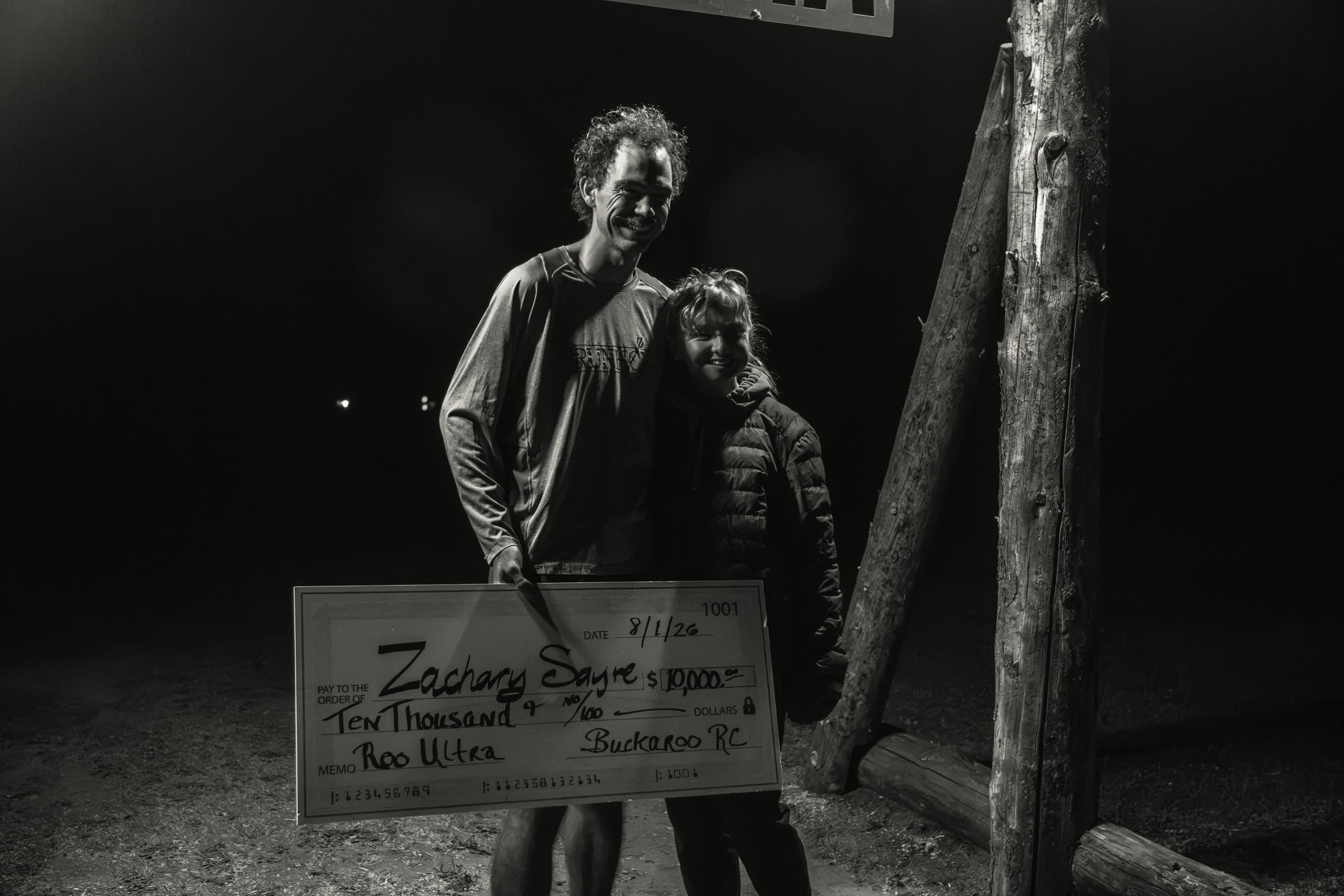 Zachary Sayre, 2026 ROO Ultra champion, photographed at night after the race